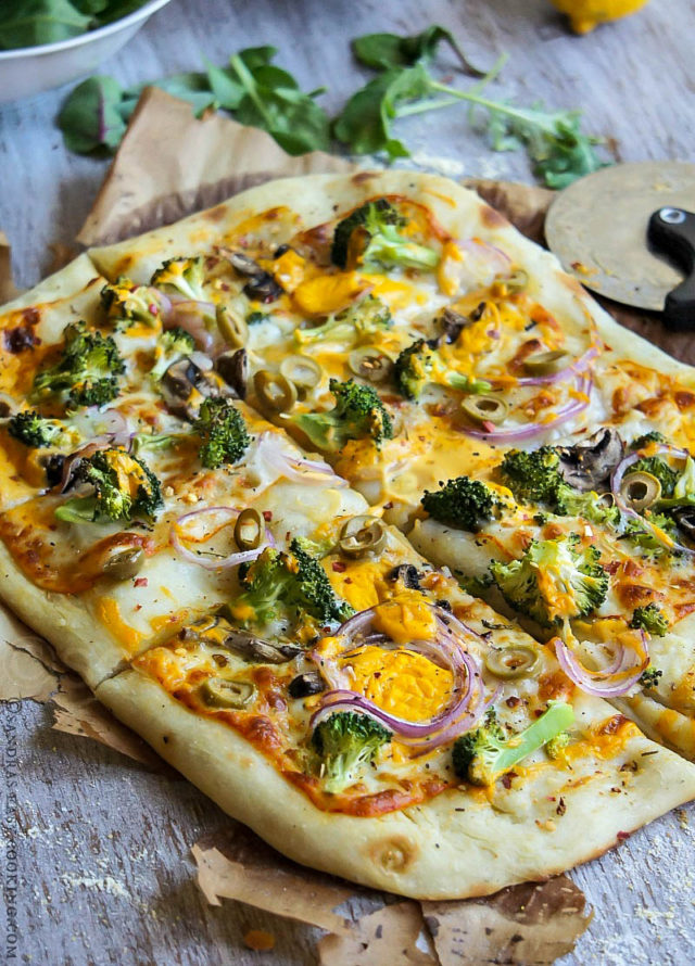 Artisan Pizza is an ultimately amazing veggie pizza topped with Broccoli, red onion, mushrooms, olives and two kind of cheese. Lunch perfection!